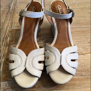 Clarks artisan white wedge leather sandal. Beautiful pattern on side. Size 8.